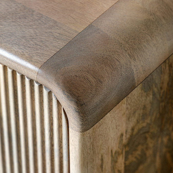 close up image of smooth curved edge of mango wood tv unit