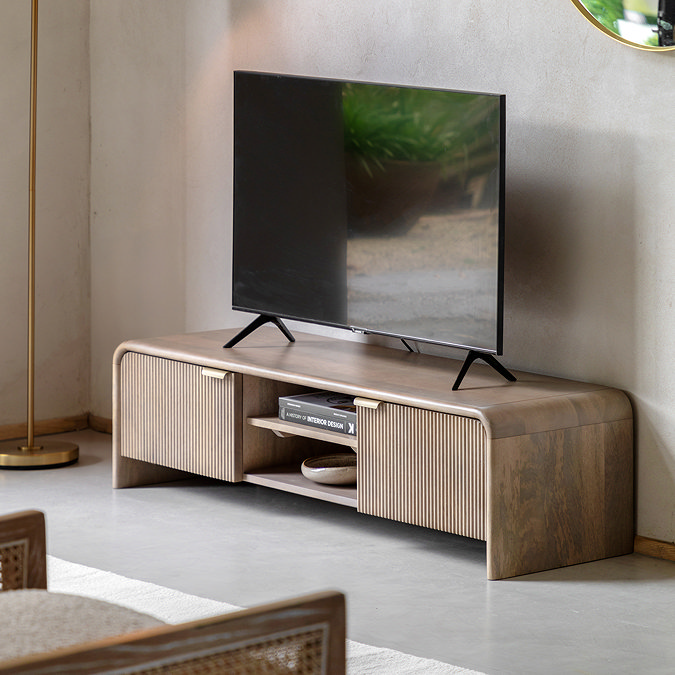 image of mango wood media unit with tv on top, two fluted drawers on either side of two shelves