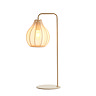 cut out of cream table lamp with sheer flower-inspired shade, warm glow emitting from bulb inside