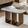 close up on gold geometric base of coffee table with smooth marble top