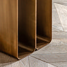 close up on gold geometric base of side table
