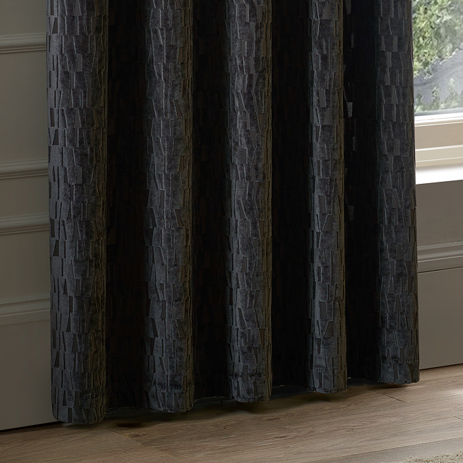 Manhattan Eyelet Curtains in Charcoal over a window close up image