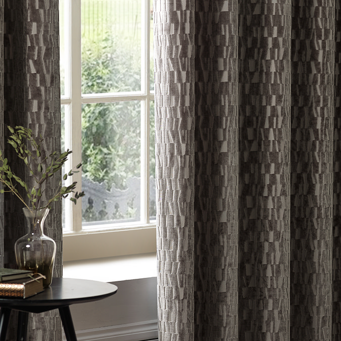 Manhattan Mink Eyelet Curtains over a window close up image