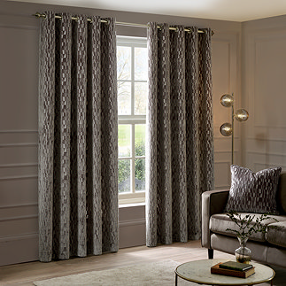 Manhattan Mink Eyelet Curtains over a window image