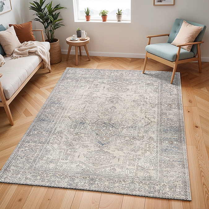 image of large grey vintage floral patterned rug on light wood floor of modern apartment