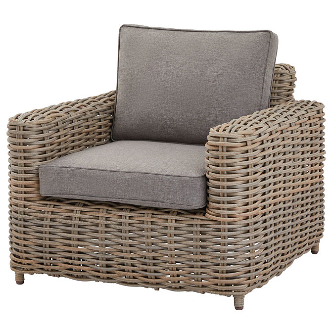 image cut out on white background of rattan armchair with plush grey seat pads and back cushion