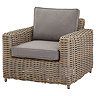 image cut out on white background of rattan armchair with plush grey seat pads and back cushion