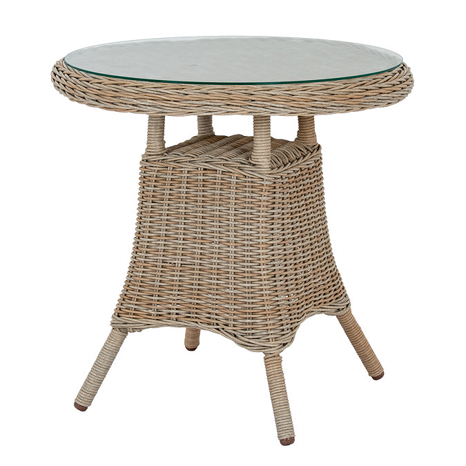 image cut out on white background of wicker-effect bistro table with tempered glass top