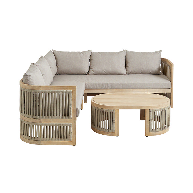 image cut out on white background of wooden curved sofa set with beige cushion seating and matching slatted table