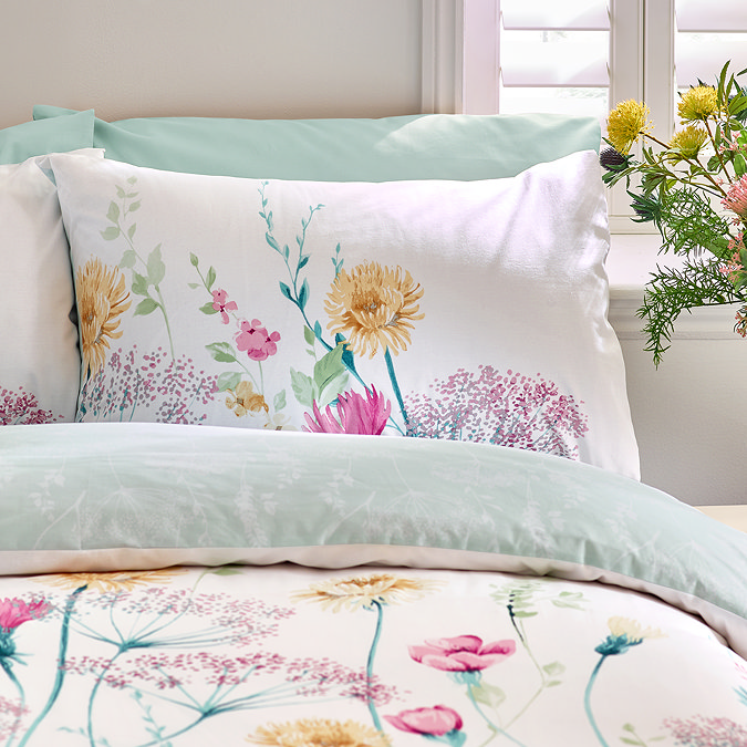 Meadowsweet Floral Bright Duvet cover set on bed close up image 1