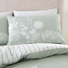 Meadowsweet floral sage green duvet cover set on bed image 1
