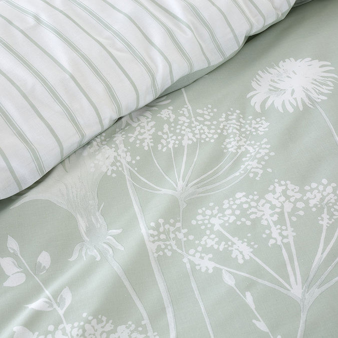 Meadowsweet floral sage green duvet cover set on bed close up image 2