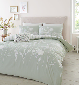 Meadowsweet floral sage green duvet cover set on bed image 1