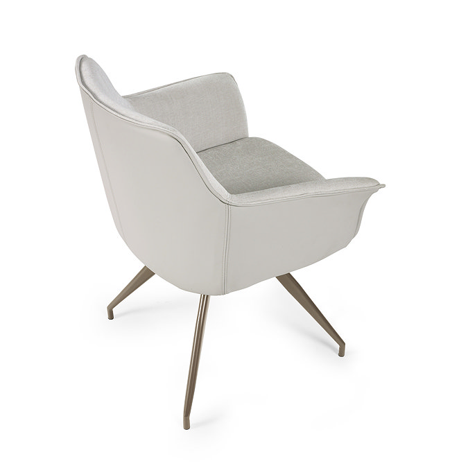 image cut out on white background of light grey chenille chair with leather back