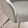 close up image on corner of light grey chenille chair with leather PU back