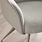close up image on corner of light grey chenille chair with leather PU back