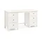 angled image cut out on white background of off-white dressing table with two sets of 3 drawers on each side