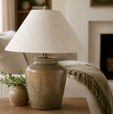 wide shot of mottled green lamp on side table of living room