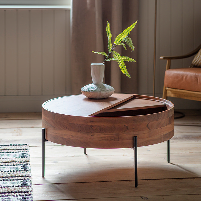 image of round wood storage coffee table, with half its top moveable to reveal drawer to put things in, pant on top