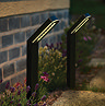 image of modern stake lights on border of garden pathway emitting warm white light