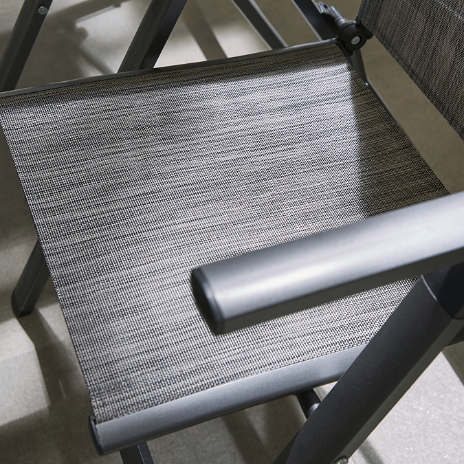 close up image of sleek grey material of outdoor dining chairs