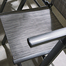 close up image of sleek grey material of outdoor dining chairs