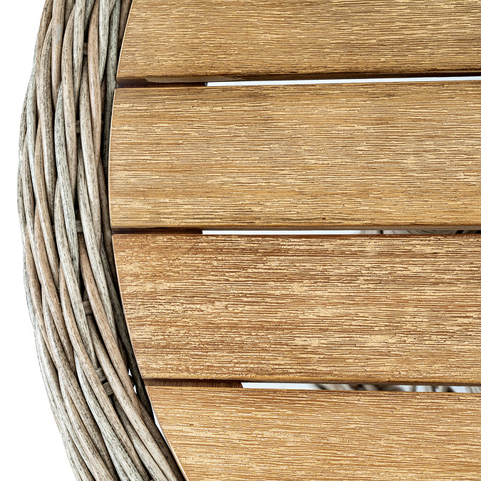 close up image of wood tabletop of wicker bistro table