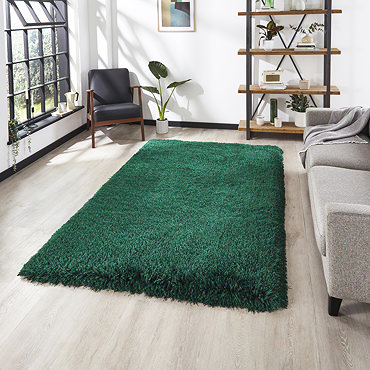 image of emerald green shaggy rug folded over in corner to show floor-facing material underneath