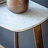 close up image of marble surface of console table