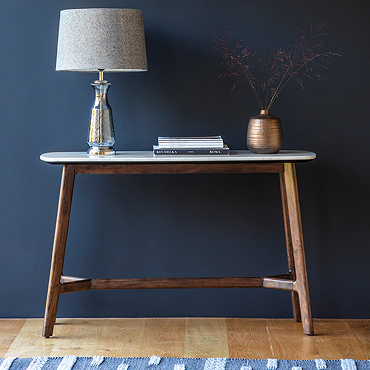 close up image of rounded edge of marble top of console table