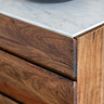close up image of dark wood of sideboard drawers with marbletop