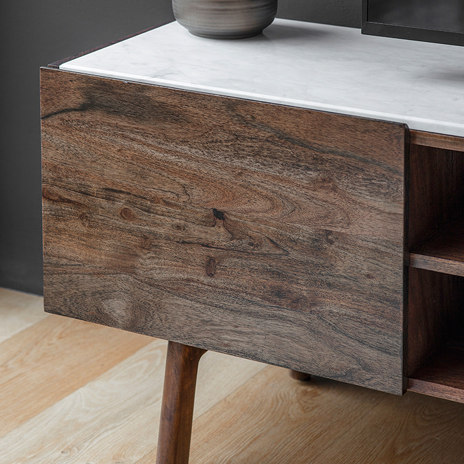 close up on acacia wood doors of tv unit