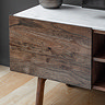 close up on acacia wood doors of tv unit