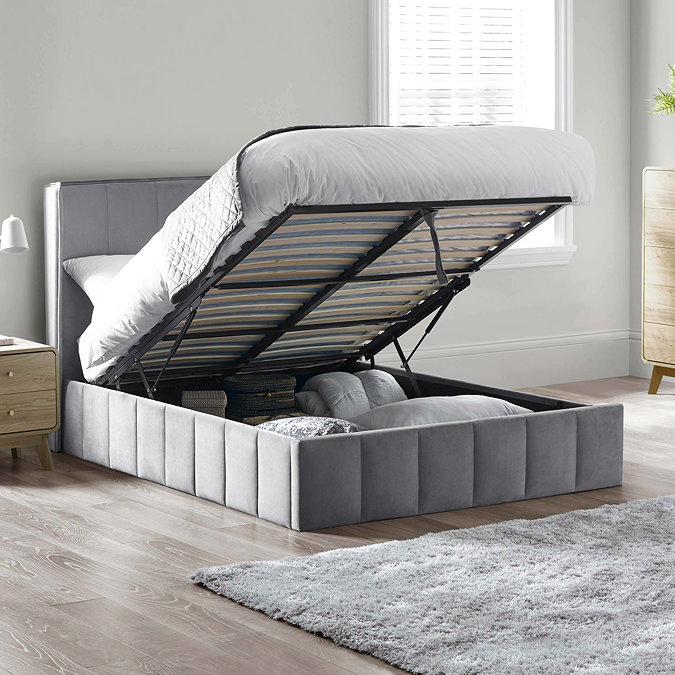image of grey panelled velvet bed with ottoman storage lifted up to reveal space within