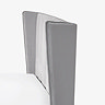 close up image of subtle winged shape of grey velvet headboard
