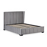 image cut out on white background of grey velvet panelled bedframe with slatted base without mattress