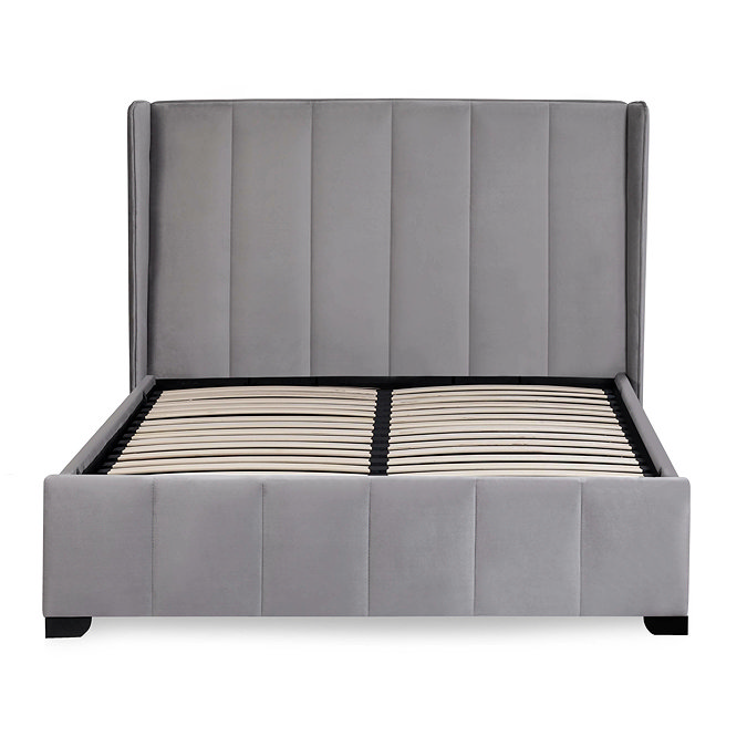 front on image cut out on white background of slatted bed with grey panelled headboard in velvet