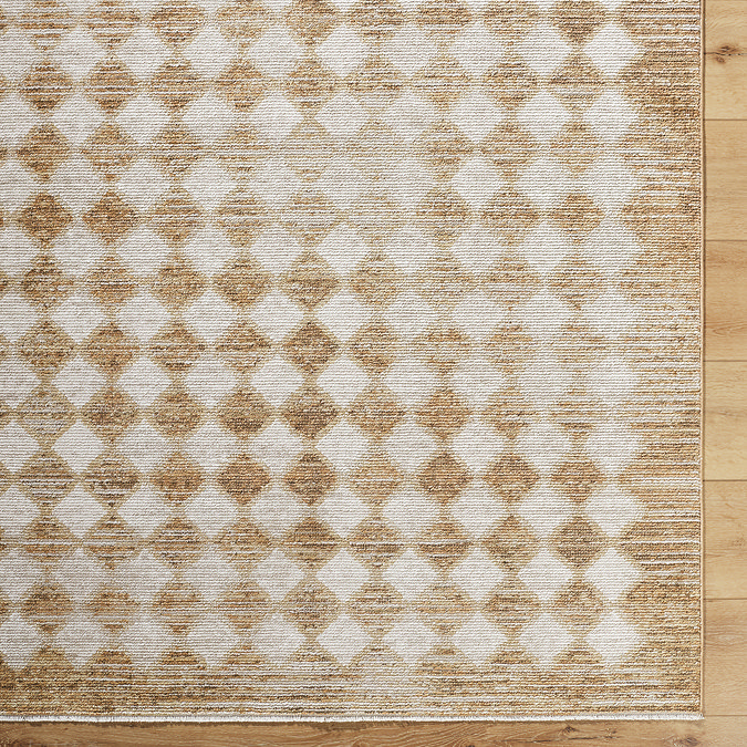 close up image of mustard and cream diamond patterned rug