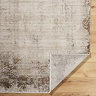 image of rustic brown rug folded over at the corner to show material underneath