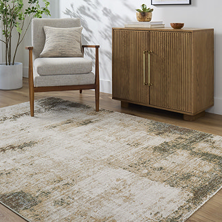 image of rustic olive green and brown rustic rug on light wood flooring