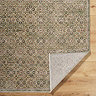 close up image of corner of rug folded over to show material underneath