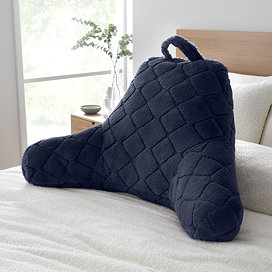 Cosy diamond cuddle chair cushion in navy on bed image 1