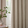 Neptune Eyelet Curtains in champagne over a window close up image