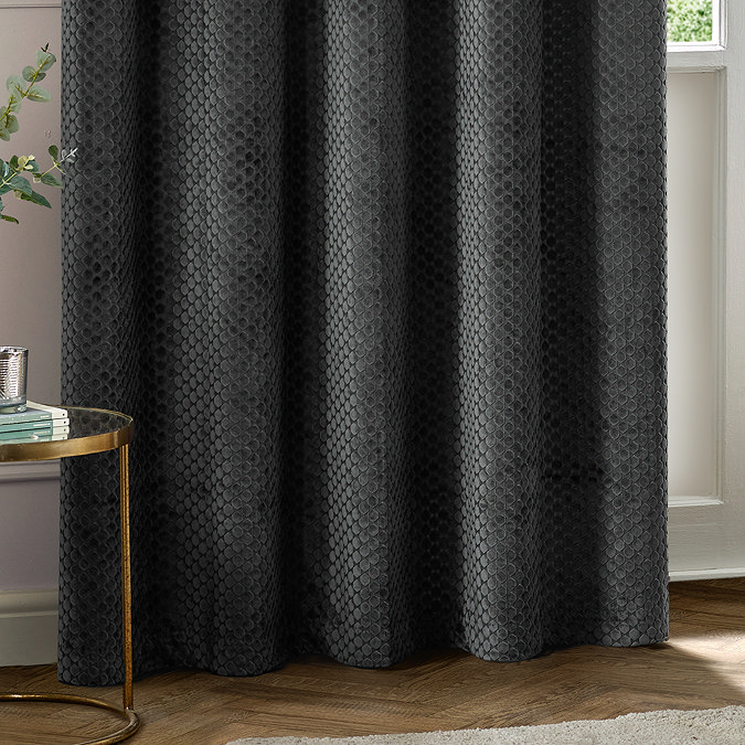 Neptune Charcoal Eyelet Curtains over a window close up image