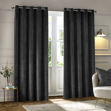 Neptune Charcoal Eyelet Curtains over a window close up image