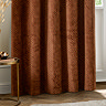 Neptune Eyelet Curtains in Copper over a window close up image