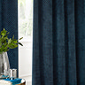 Neptune Eyelet Curtains in Navy over a window close up image