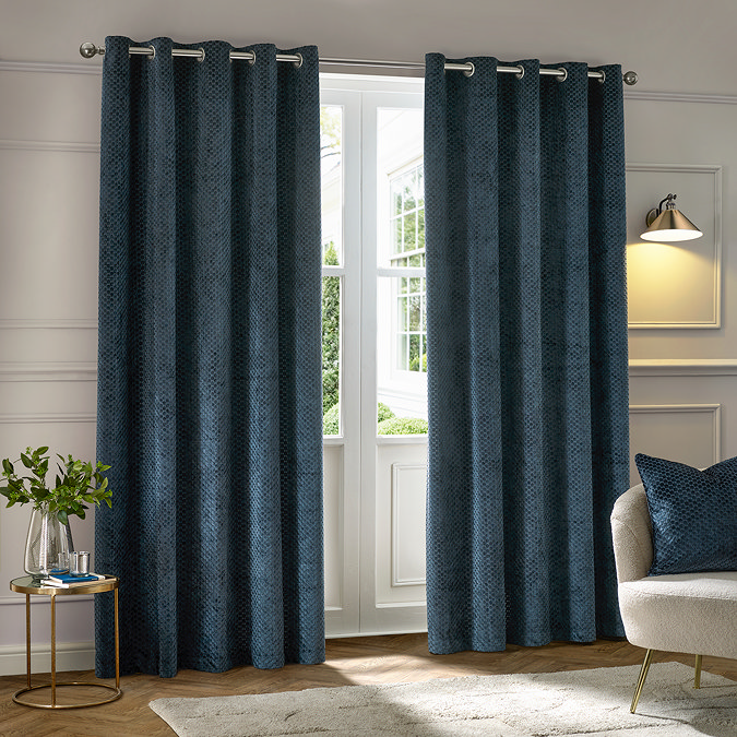 Neptune Eyelet Curtains in Navy over a window image