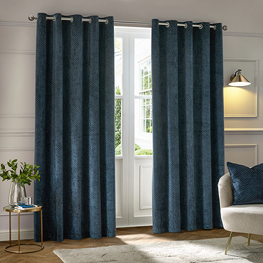 Neptune Eyelet Curtains in Navy over a window close up image