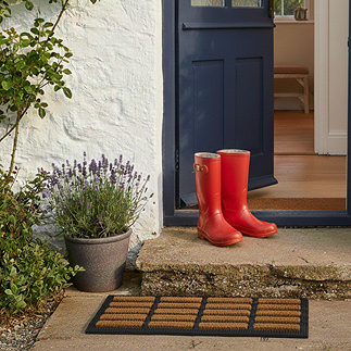 Boot Scraper Doormat in Front of Cottage Step